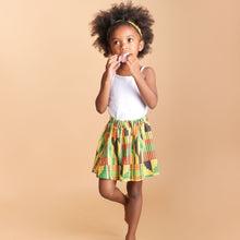Load image into Gallery viewer, Little girl wearing a skirt
