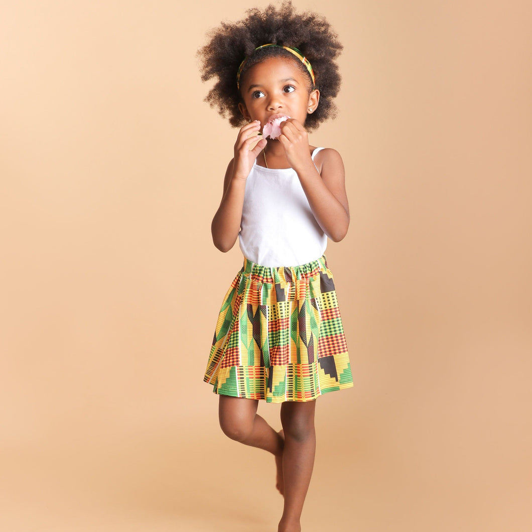 Little girl wearing a skirt